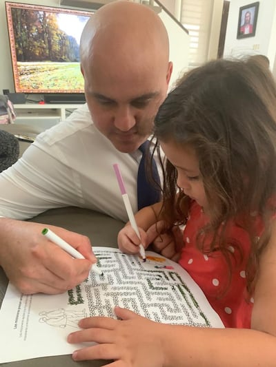 Wilfred Rosa and his daughter, Marina, work together on a missionary-themed coloring project on March 29, 2020. Rosa and his family accepted President Russell M. Nelson’s invitation to fast for a resolution of the coronavirus pandemic.
