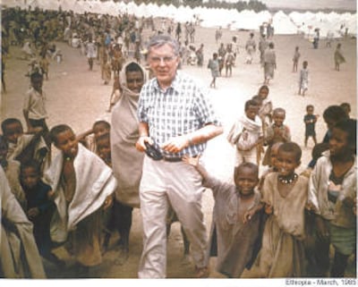 Children gathered around Elder M. Russell Ballard, then of the Presidency of the Seventy, during his visit to Ethiopia in 1985 to determine how to best utilize more than $6 million raised during a special Jan. 27, 1985, fast.