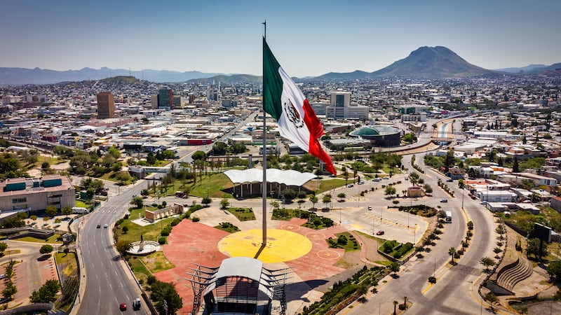 A Mexico flag flies in in this aerial view of Chihuahua, Mexico.