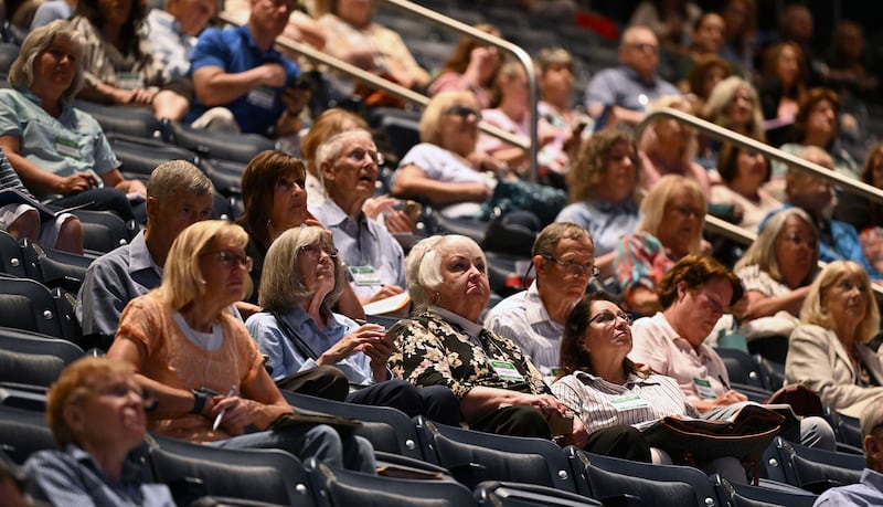 Audience members listen in the Marriott Center for 2024 BYU Education Week.