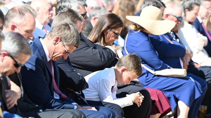Guests bow their heads during the dedicatory prayer at the Heber Valley temple groundbreaking in Heber City, Utah, on Saturday, Oct. 8, 2022.
