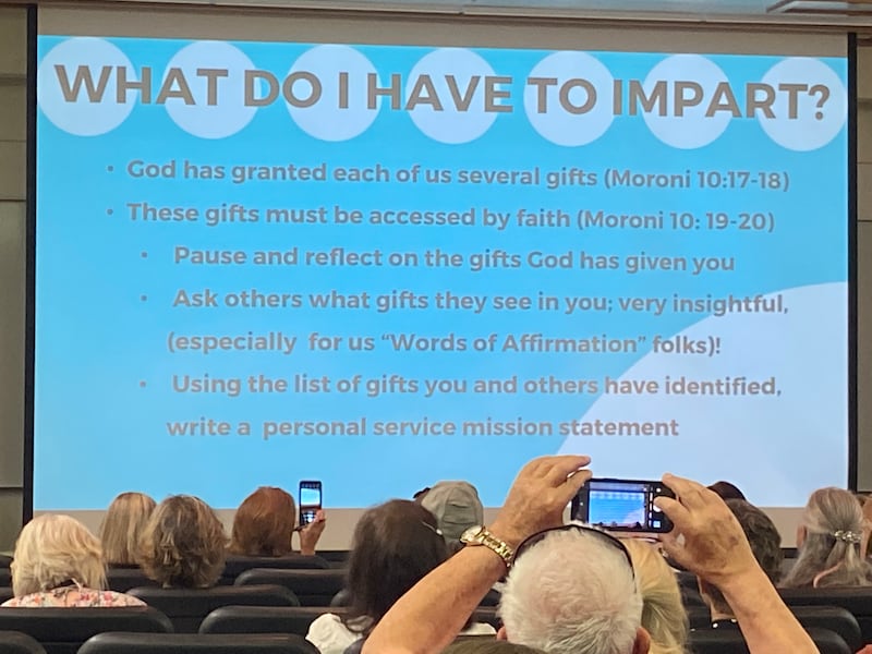 A presentation slide at the front of a lecture hall, explaining that everyone has several God-given gifts.