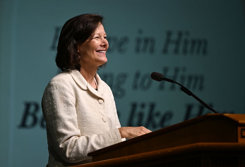 President Susan H. Porter smiles at the Marriott Center audience during 2024 BYU Education Week.