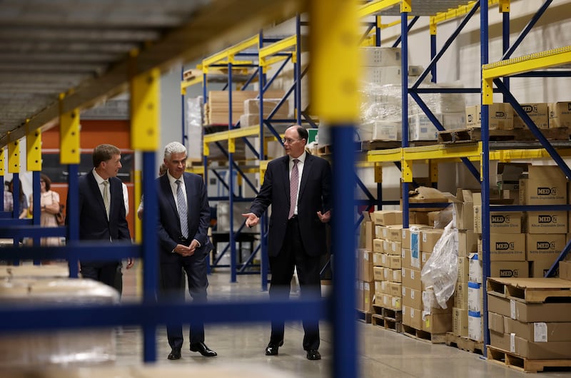 Bishop L. Todd Budge, Presiding Bishop Gérald Caussé and Bishop W. Christopher Waddell tour the stockroom at the bishops’ storehouse.