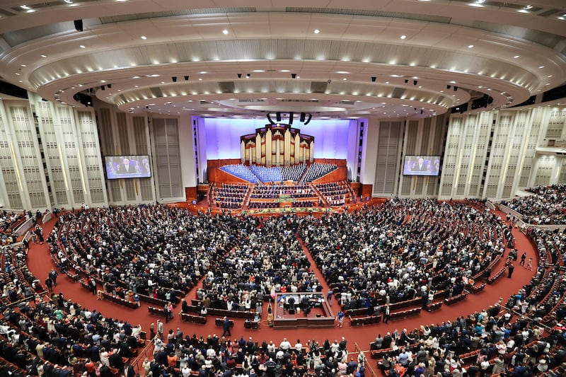 Conferencegoers sing during a congregational hymn during the Sunday morning session of the 193rd Annual General Conference.