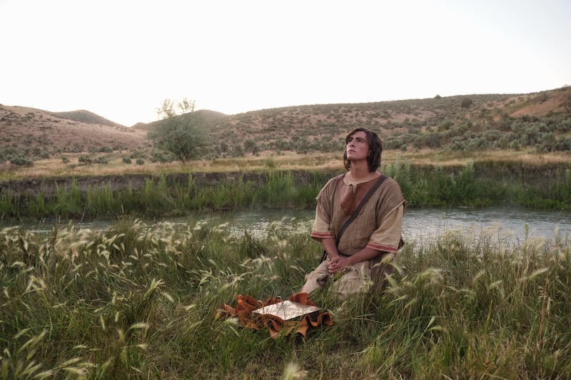 Nephi prays by a stream, as depicted in this photograph from the portrayal in the Book of Mormon Videos.