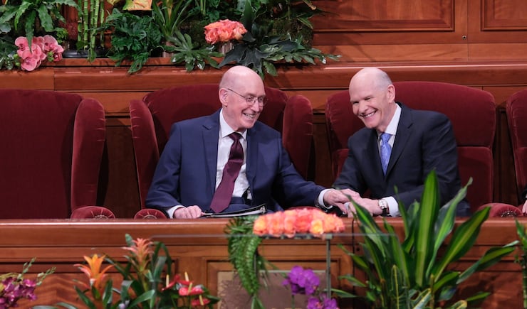 President Henry B. Eyring and Elder Dale G. Renlund share a moment during the Saturday evening session of April general conference.