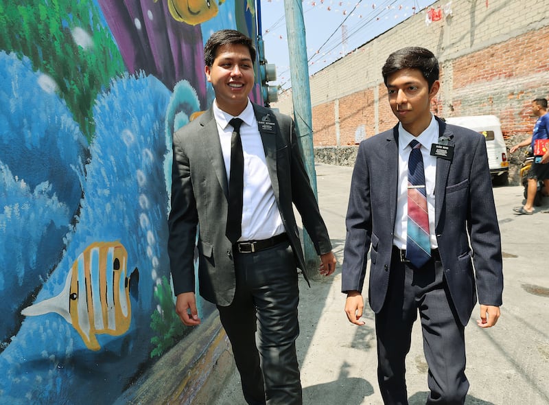 Elders Adam Betancio and Luis Reyes do their missionary work in Mexico City.