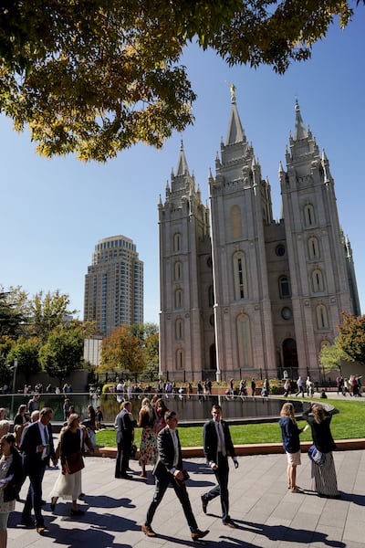 People walk outside Temple Square before the Saturday afternoon session of the 189th Semiannual General Conference of The Church of Jesus Christ of Latter-day Saints in Salt Lake City on Saturday, Oct. 5, 2019.