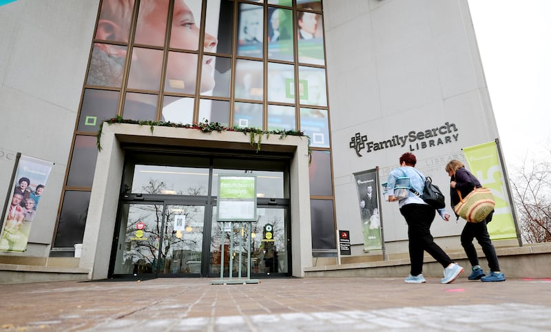 Two women walk toward the doors of the FamilySearch Library in Salt Lake City on Monday, Jan. 9, 2023.