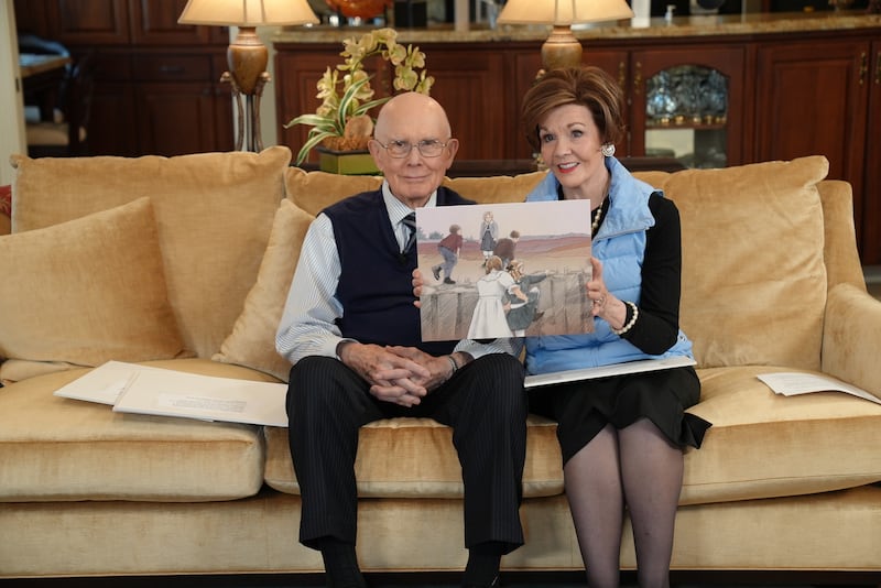 President Dallin H. Oaks and Sister Kristen M. Oaks hold up pictures as they tell a story to their great-grandchildren during the March 2024, Friend to Friend broadcast.