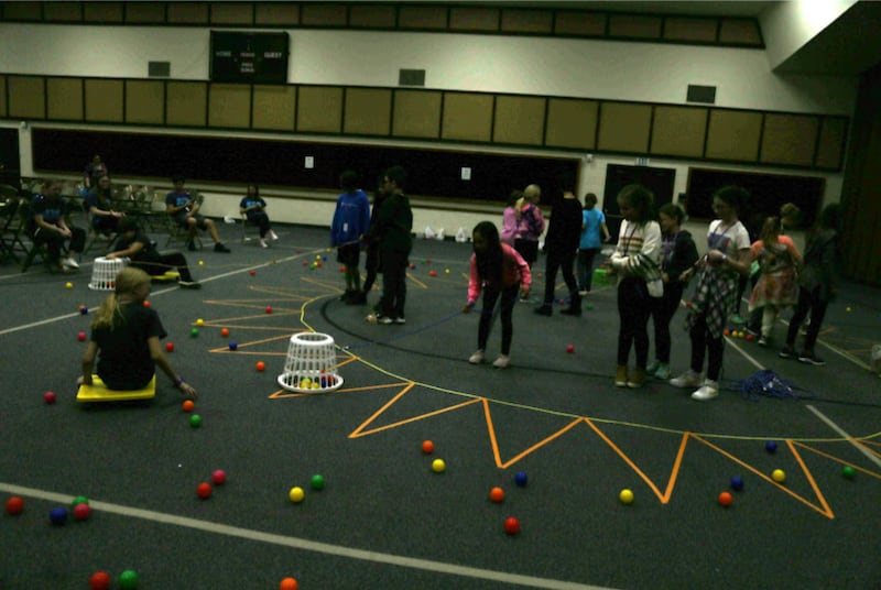 Children play a hungry hippos-type game during a stake Primary day camp in Corpus Christi, Texas.